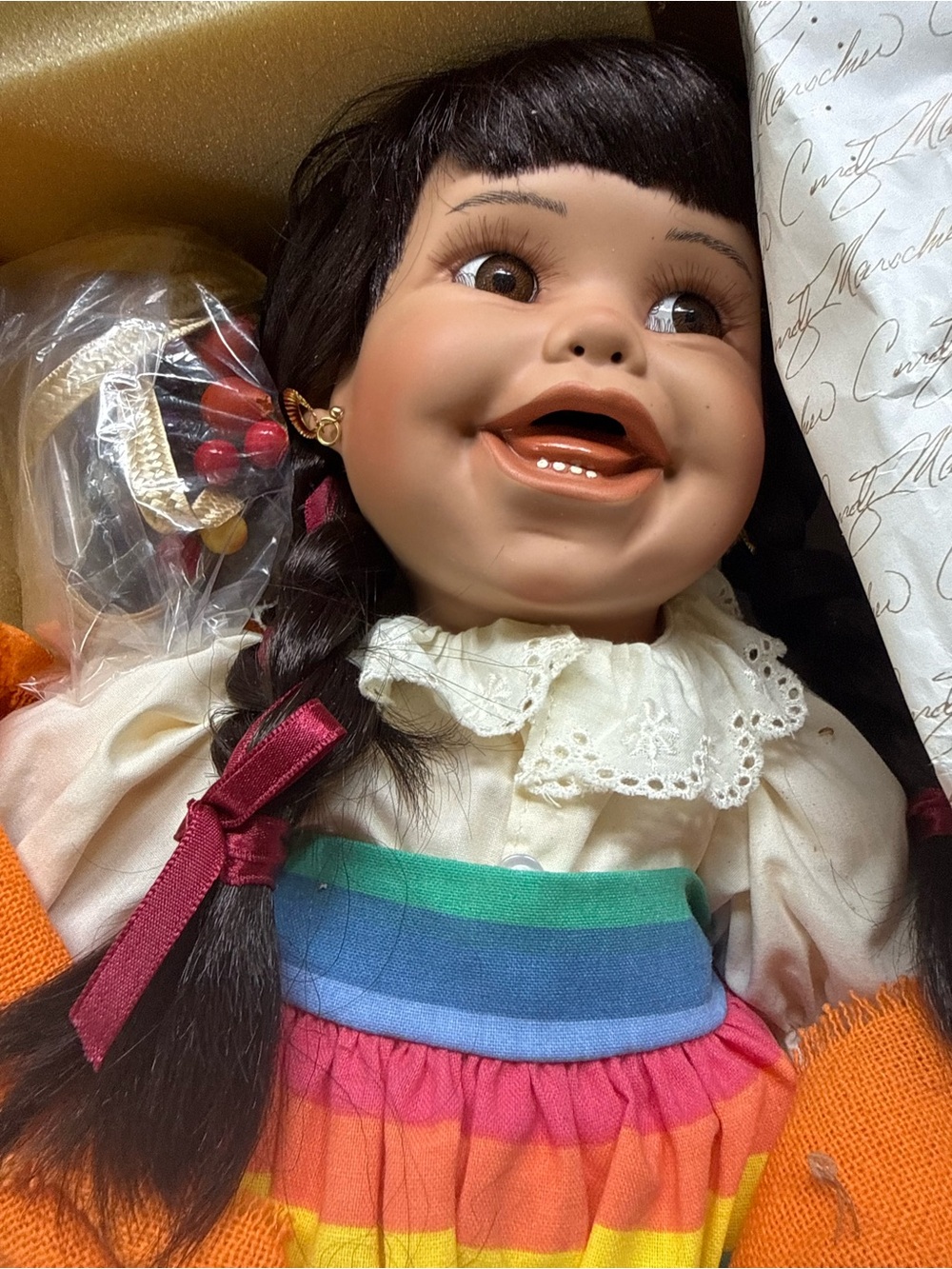 Gallery Smiling Doll in Rainbow Dress with Brown Braided Hair